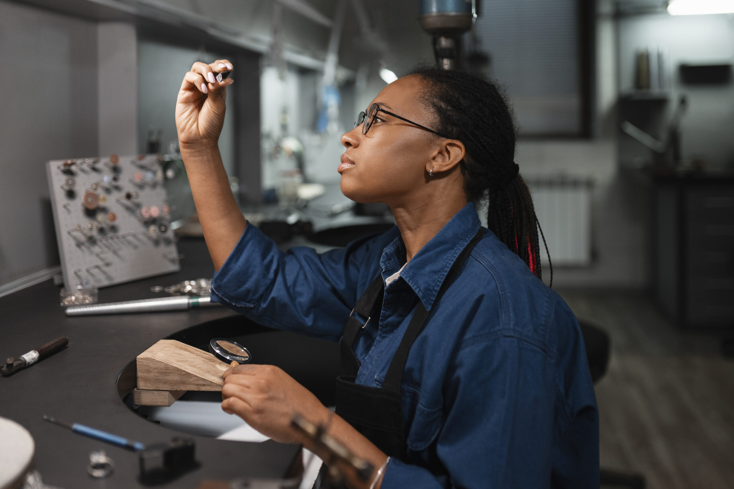 female-jeweler-working-shop